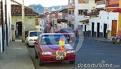 New Years Eve and traditional decoration of cars with Monigotes or Paper Mache. Cuenca, Ecuador Editorial Stock Photo