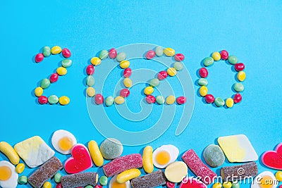 New years 2020. Pile of delicious colourful chewing candies background. Colourful sweets with space for your text Stock Photo