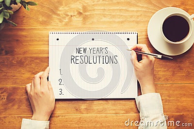 New years resolution with a person holding a pen Stock Photo