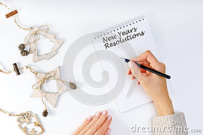 New years resolution with a person holding a pen and notebook. Resolutions, Goals Stock Photo