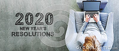 2020 New Years Resolutions with man using a laptop Stock Photo