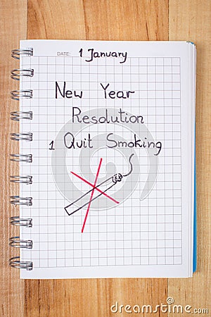 New years resolutions written in notebook, quit smoking Stock Photo