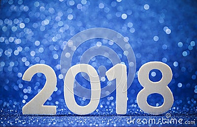 New Years 2018 white wood numbers on blue paper Stock Photo