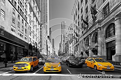 NEW YORK - APRIL 15: Yellow taxis rides on 5th Avenue on April 1 Editorial Stock Photo