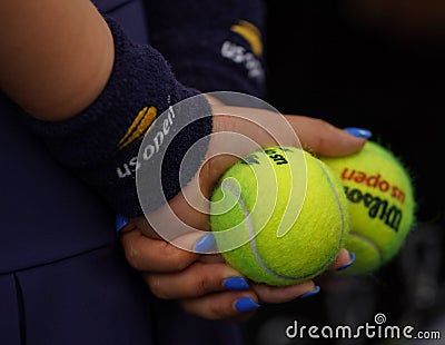 Ball boy holds US Open Wilson tennis ball at Billie Jean King National Tennis Center in New York Editorial Stock Photo