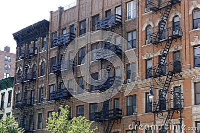 New York brick buildings with outside fire escape stairs Editorial Stock Photo
