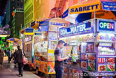 New York, Broadway at night. Take away fast food kiosks selling hot dog Editorial Stock Photo