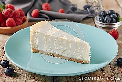 New York Cheesecake on Blue Plate Close Up Stock Photo