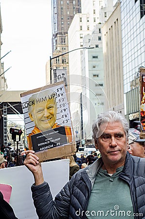 Man holds a arrest Donald Trump sign following his indictment in April 2023 Editorial Stock Photo