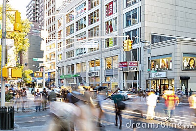 New York City - Diverse crowds of people walk through the crowded intersection on 14th Street at Union Square Park Editorial Stock Photo