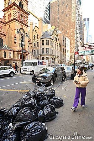 Black plastic trash bags full of garbage Editorial Stock Photo