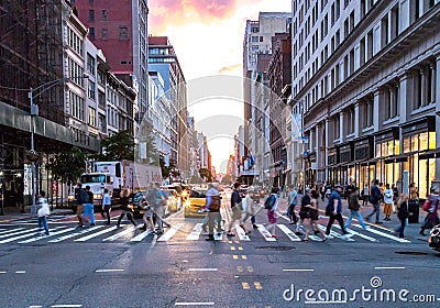 Crowds of diverse people cross the busy intersection on 23rd Street and 5th Avenue in Manhattan New York City Editorial Stock Photo