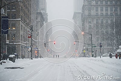 New York City Manhattan Midtown street under the snow during snow blizzard in winter. Empty 5th avenue with no traffic Stock Photo