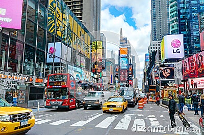 NEW YORK CITY, MANHATTAN, OCT,25, 2013: NYC Times Square lights screens buildings fashion boutiques architecture and advertising l Editorial Stock Photo