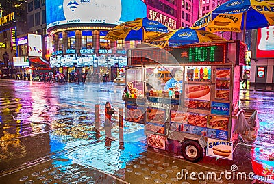 NEW YORK CITY - MAY 21: A hot dog stand vendor stays open late i Editorial Stock Photo