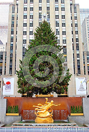 New York City Rockefeller Center, the traditional christmas tree and the gilt bronze sculpture of Prometheus. Editorial Stock Photo