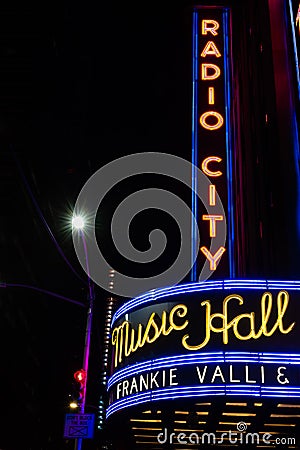 NEW YORK CITY - SEPTEMBER 02, 2018: View of Radio City Music Hall in Manhattan at night with Frankie Valli on marquee. Editorial Stock Photo