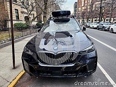 New York City, USA - February 10, 2024: BMW X5 with roof box parked outdoor, front view Editorial Stock Photo