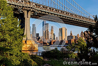 New York City / USA - JUN 25 2018: Lower Manhattan skyline at sunrise view from Brooklyn Bridge Park Editorial Stock Photo