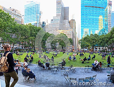 New York City, USA - June 7, 2017: People relaxing at Bryant park at afternoon, New York city Editorial Stock Photo