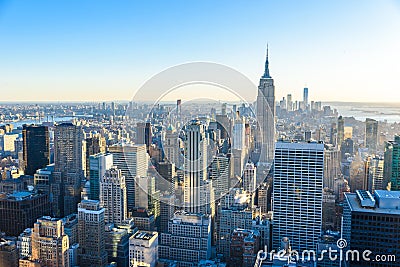 New York City - USA. View to Lower Manhattan downtown skyline with famous Empire State Building and skyscrapers at sunset. Stock Photo