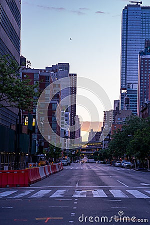 New York crowds and traffic at night. Empty road goes through Manhattan island near Time Square Editorial Stock Photo