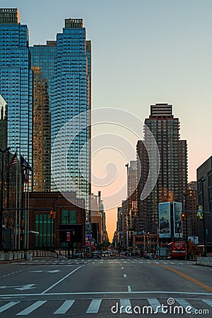 New York crowds and traffic at night. Empty road goes through Manhattan island near Time Square Editorial Stock Photo