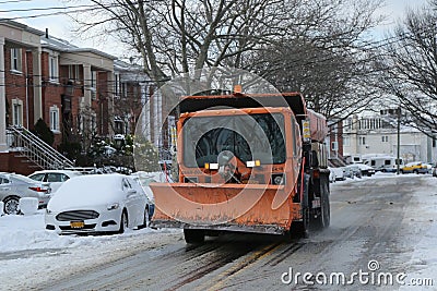 New York Department of Sanitation truck cleaning streets in Brooklyn, NY after massive Winter Storm Helen Editorial Stock Photo