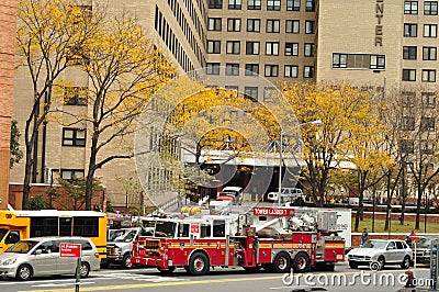 New York Fire Truck in front of yellow trees in autumn Editorial Stock Photo