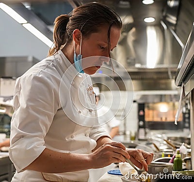 Executive Sous Chef Christin Bourgeois in the kitchen of newest Micheline Star Chef Daniel Boulud`s restaurant Le Pavillon Editorial Stock Photo