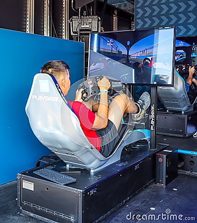 Gamers enjoy Playseat Formula E new racing simulator inside the Gaming Arena during 2019 New York City E-Prix Editorial Stock Photo