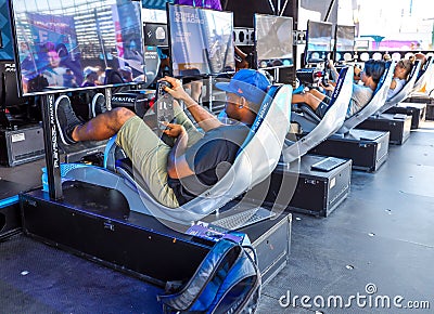 Gamers enjoy Playseat Formula E new racing simulator inside the Gaming Arena during 2019 New York City E-Prix Editorial Stock Photo