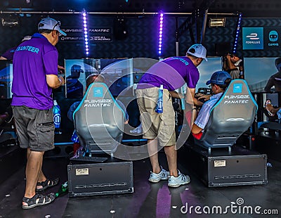 Gamers enjoy Playseat Formula E new racing simulator inside the Gaming Arena during 2019 New York City E-Prix Editorial Stock Photo