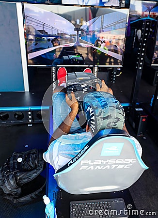 Gamers enjoy Playseat Formula E new racing simulator inside the Gaming Arena during 2019 New York City E-Prix Editorial Stock Photo