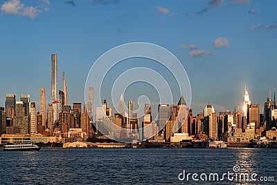 New York Manhattan skyline at sunset, business skyscrapers and golden hour Stock Photo