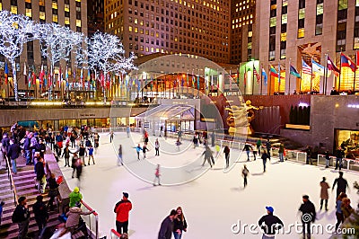 NEW YORK - MARCH 18, 2015: Tourists and newyorkers skate in the famous Rockefeller Center skatink rink, New York City. Editorial Stock Photo