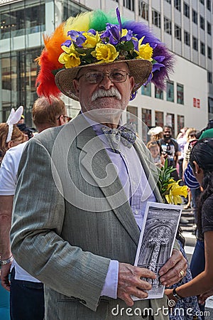 New York, New York: A dapper gentleman wearing a hat with flowers and feathers Editorial Stock Photo