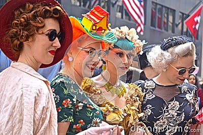 A group of young women wearing colorful, creative costumes at the Fifth Avenue Easter Parade Editorial Stock Photo