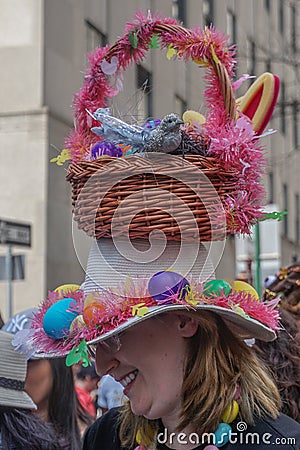 New York, New York: A smiling young woman wears an elaborate Easter bonnet Editorial Stock Photo