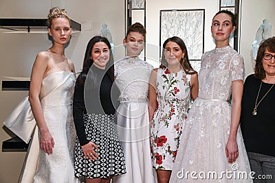 Models, designer Gracy Accad C and Atelier PR staff prosing during the Gracy Accad Spring 2020 bridal presentation Editorial Stock Photo