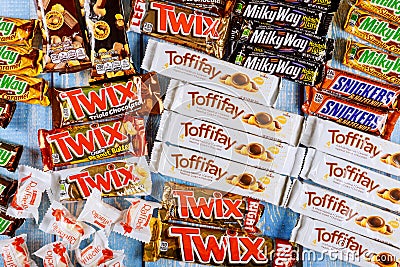 Chocolates assortment of chocolate sweets incorporated manufactured Toffifee, Milky way, Raffaello, snickers, Twix, Mars, hersheys Editorial Stock Photo