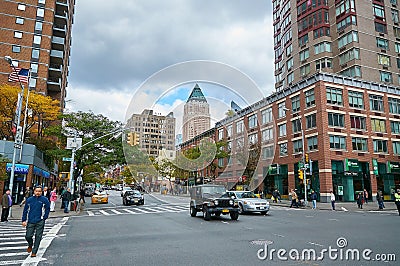 NEW YORK CITY, MANHATTAN, OCT,25, 2013: View on NYC street and road with cars, people with buildings and shops in the background. Editorial Stock Photo