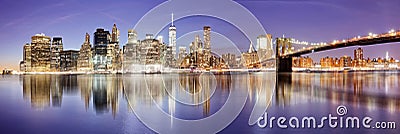 New York panorama with Brooklyn bridge at night, USA Stock Photo