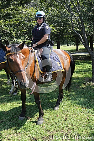 NYPD mounted unit police officer ready to protect public in Flushing Meadows Park Editorial Stock Photo