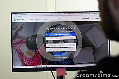 New York, USA - 26 April 2021: Glassdoor website page on screen, man using service, Illustrative Editorial Editorial Stock Photo