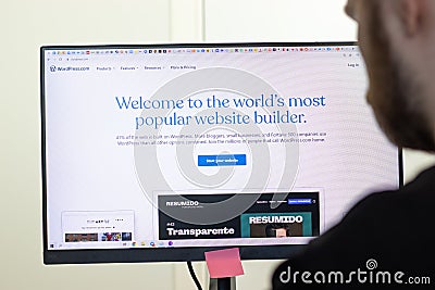 New York, USA - 26 April 2021: WordPress website page on screen, man using service, Illustrative Editorial Editorial Stock Photo