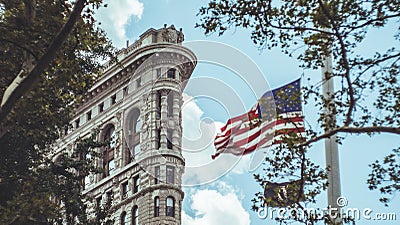 Flatiron Building with American flag Editorial Stock Photo