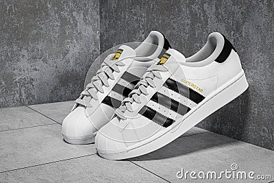 New York, USA - June 20 , 2023 : Adidas Superstar original white sneakers. Sport and fashion footware. white and black sneaker on Editorial Stock Photo