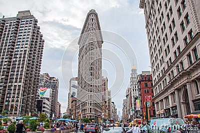 New York, USA - June 12, 2014: View of Flatiron Building on the street of Broadway in New York City Editorial Stock Photo