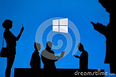 NEW YORK, USA, 25. MAY 2020: Microsoft Windows graphical operating system Group of business people chat on mobile phone and laptop Editorial Stock Photo